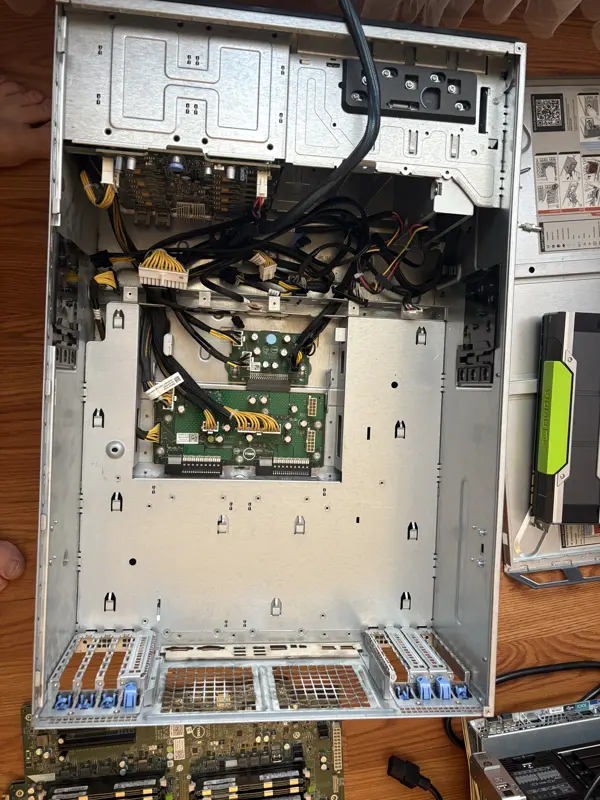 Server teardown: chassis stripped to the power distribution board